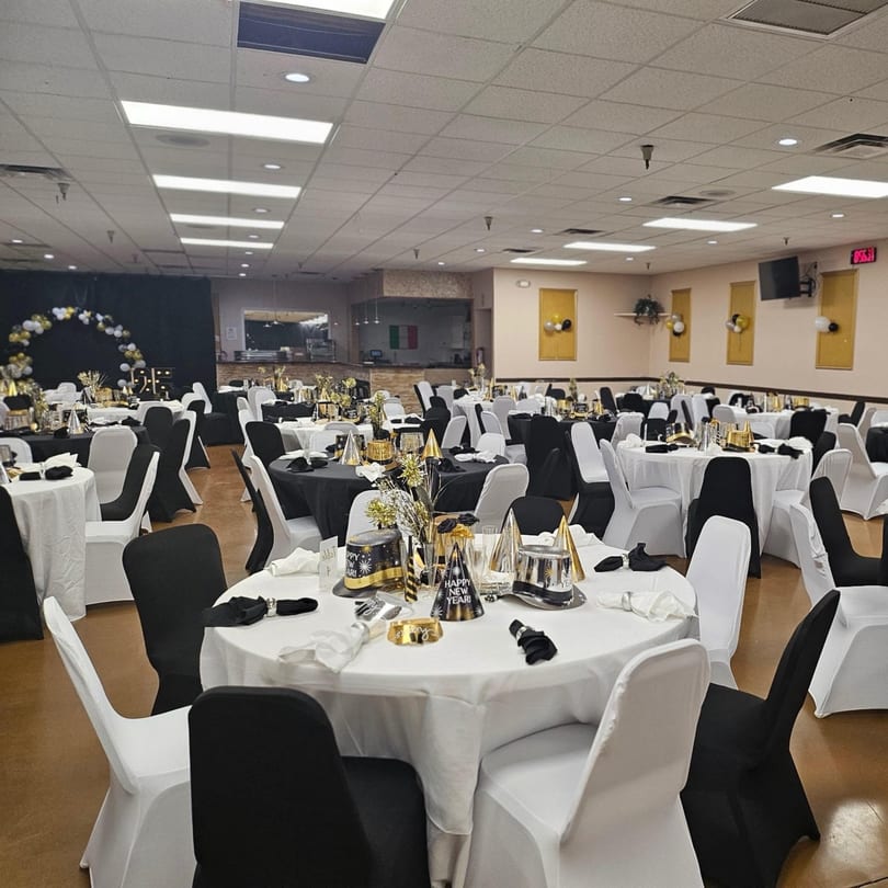 Galindo's spacious dining room set up for a New Year's Eve party with black and white decor.